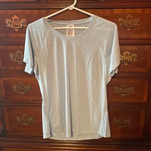 Size medium Adidas workout shirt with a cut out in back. Baby blue